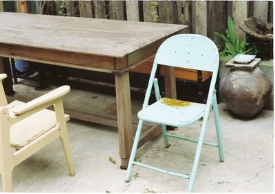 Empty chairs and wooden chair