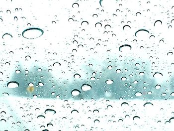 Close-up of water drops on glass window