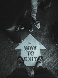 Low section of man standing on street