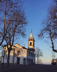 Low angle view of church against blue sky