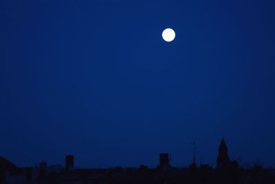 Full moon in blue sky at night