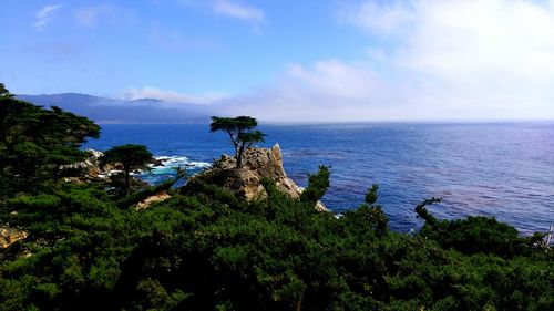 Scenic view of sea against cloudy sky