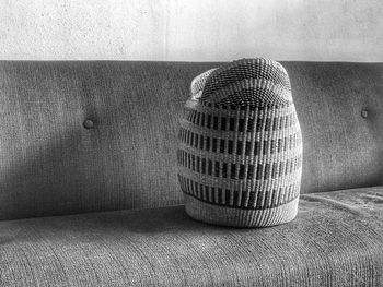 Close-up of sofa on table against wall at home