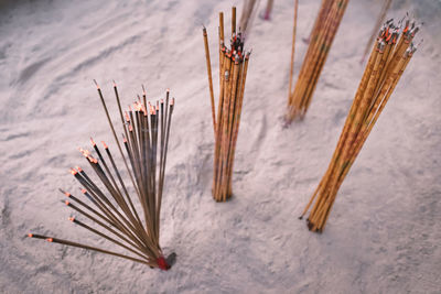 Incenses or joss sticks in chinese temple, old film look effect, shallow depth of field
