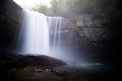 Scenic view of waterfall in forest