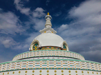 Low angle view of bell tower against sky