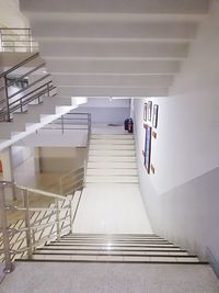 High angle view of person on staircase in building