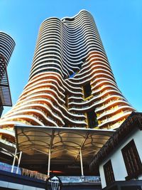 Low angle view of illuminated building against sky
