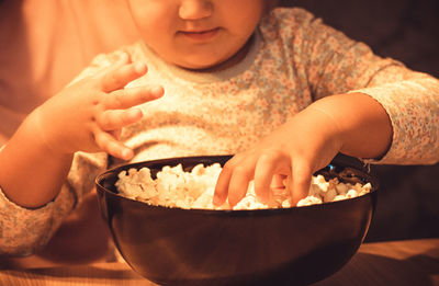 Close-up of boy holding ice cream in bowl