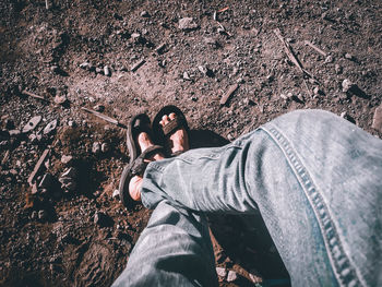 Low section of man wearing shoes