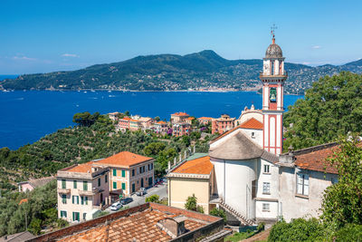 View of chiesa sant'andrea di rovereto at chiavari, portofino area visible on the horizon.