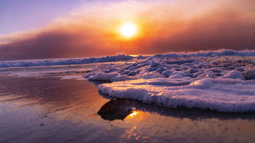 Scenic view of sea against sky during sunset