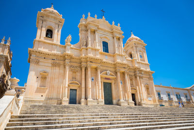 Low angle view of temple against clear blue sky