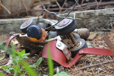 Close-up of abandoned roller skate on field