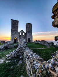 Historic building against sky during sunset