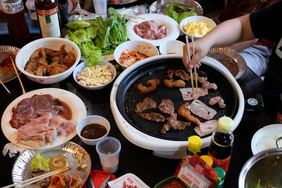 High angle view of man having food on table