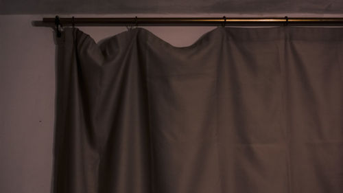 Close-up of clothes drying against black background