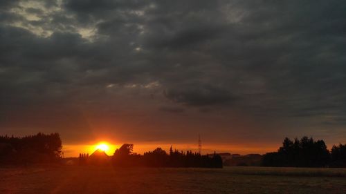 Scenic view of dramatic sky during sunset