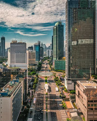 High angle view of buildings in city against sky