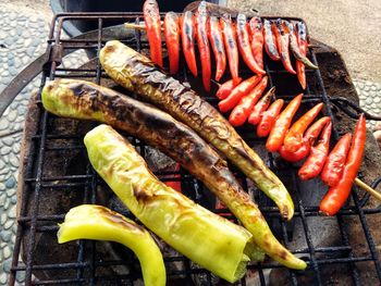 High angle view of meat on barbecue grill