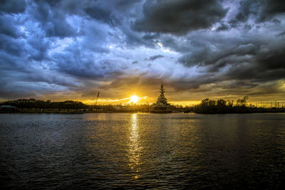 View of lake against cloudy sky during sunset