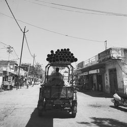 Pipes on pick-up truck at street