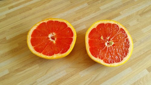 High angle view of grapefruit on wooden table