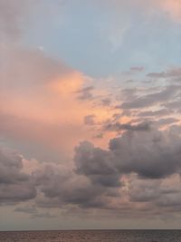 Scenic view of sea against sky at sunset