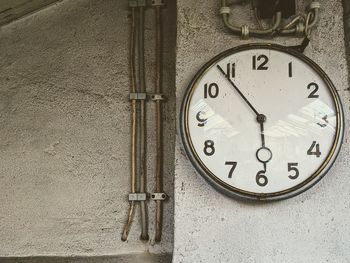 Close-up of clock on wall