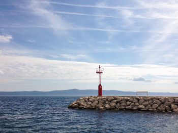 Scenic view of sea against cloudy sky