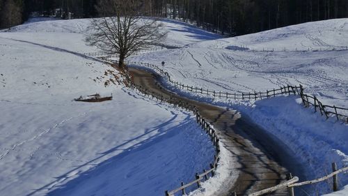 Bridge over snow covered landscape