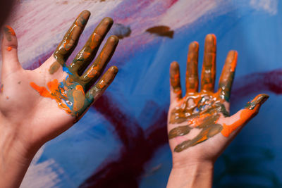 Close-up of hands with paint