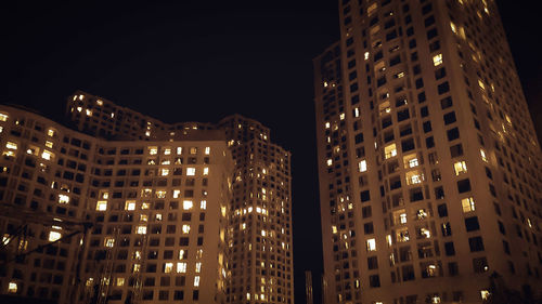 Low angle view of illuminated city at night