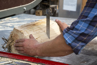 Midsection of man working at workshop