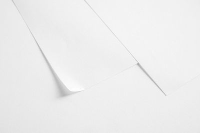 High angle view of paper on white floor
