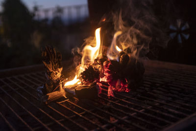 Close-up of fire on barbecue grill