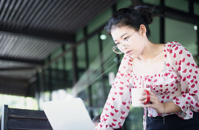 Young woman using mobile phone