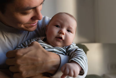 Close-up of cute baby boy at home