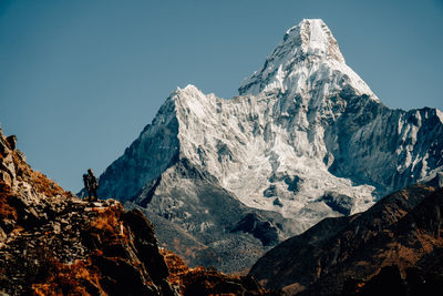 Scenic view of snowcapped mountains against clear sky