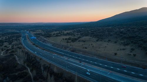 High angle view of highway against sky during sunset