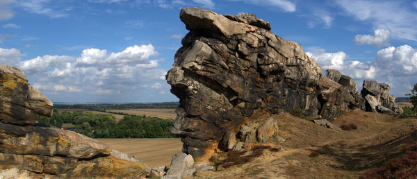 Panoramic view of rock formations against sky