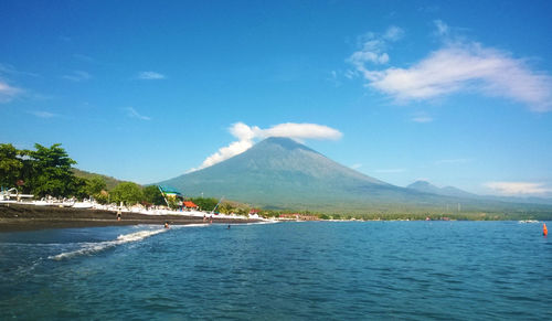 Scenic view of sea against cloudy sky