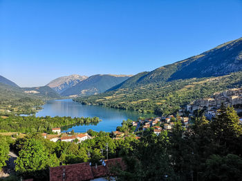 Scenic view of mountains against clear blue sky