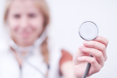 Close-up of doctor showing stethoscope