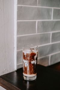 Iced coffee in glass on table at cafe