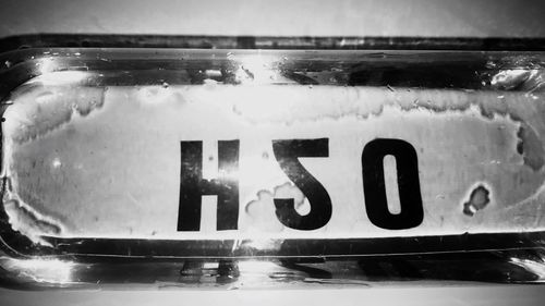 Close-up of text on water