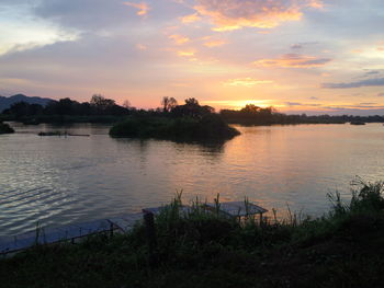 Scenic view of lake against sky during sunset
