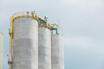 Low angle view of factory against sky