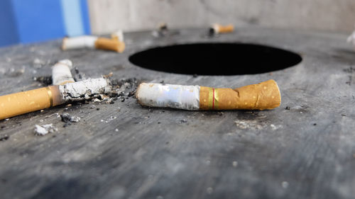 Close-up of cigarette smoking on table