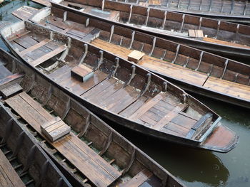 High angle view of abandoned boats moored in water